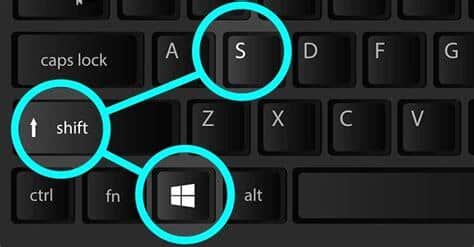 a keyboard with highlighted key of Windows + Shift + S
