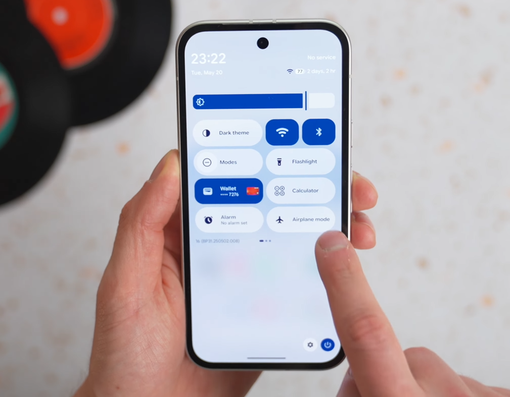 A man using Android 16 on Pixel device