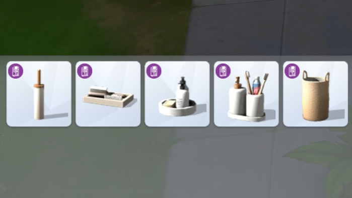 A screenshot of Build Mode where a handful of bathroom accessories have been added to the Build Mode category of Bathroom > Accents for sorting.