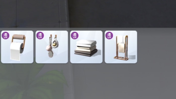 A screenshot of Build Mode where a handful of bathroom accessories have been added to the Build Mode category of Bathroom > Accents for sorting.